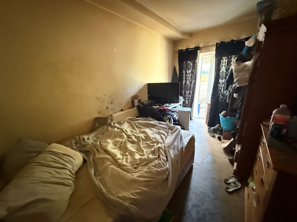 Lot: 223 - PAIR OF TWO-BEDROOM FLATS FOR INVESTMENT - Flat A Bedroom one with access to garden